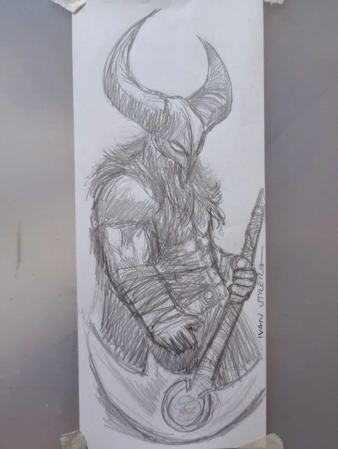 A pencil sketch of a horned, demonic-looking figure with a beard, holding a staff, drawn on paper taped to a wall. The…
