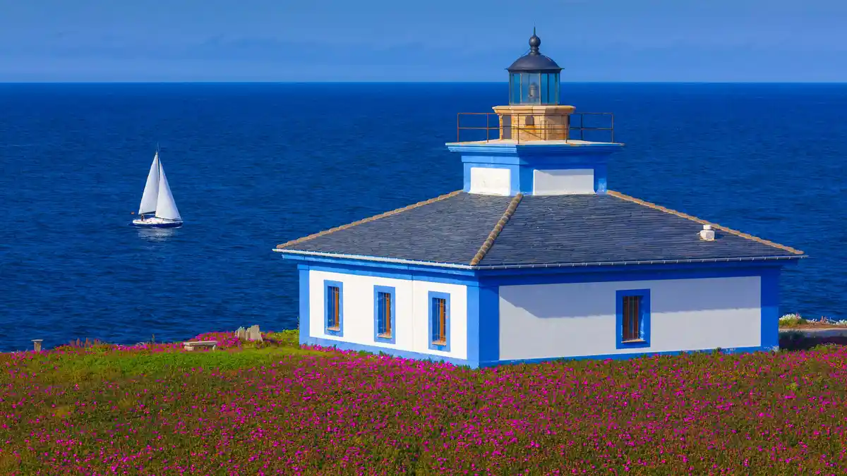 On Galicia's small Illa Pancha islet, a colorful hut stands out, housing one of the island's two lighthouses. The cozy…