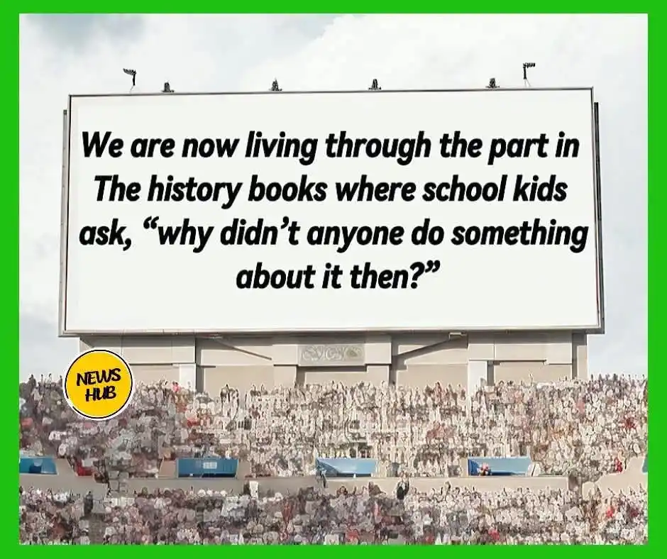 A large stadium scoreboard displays the text: 'We are now living through the part in The history books where school kids…
