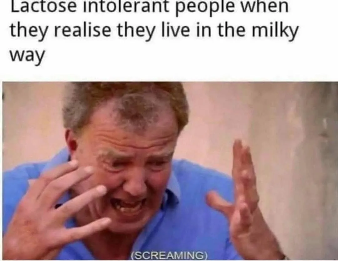 A man with graying hair and a blue shirt is captured mid-scream, his face contorted in agony, hands raised in distress. The…