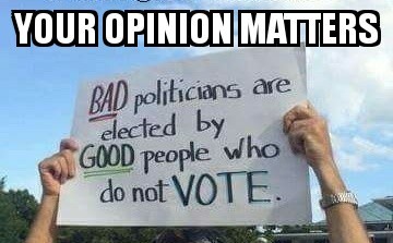 Two hands hold a handwritten sign that reads 'BAD politicians are elected by GOOD people who do not VOTE.' The word 'BAD' is…