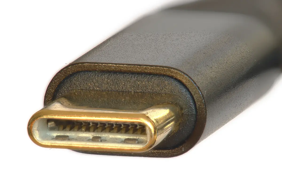 A close-up photo of a USB-C port with a gold-plated connector against a white background. The overlaid text reads 'i'm not a…