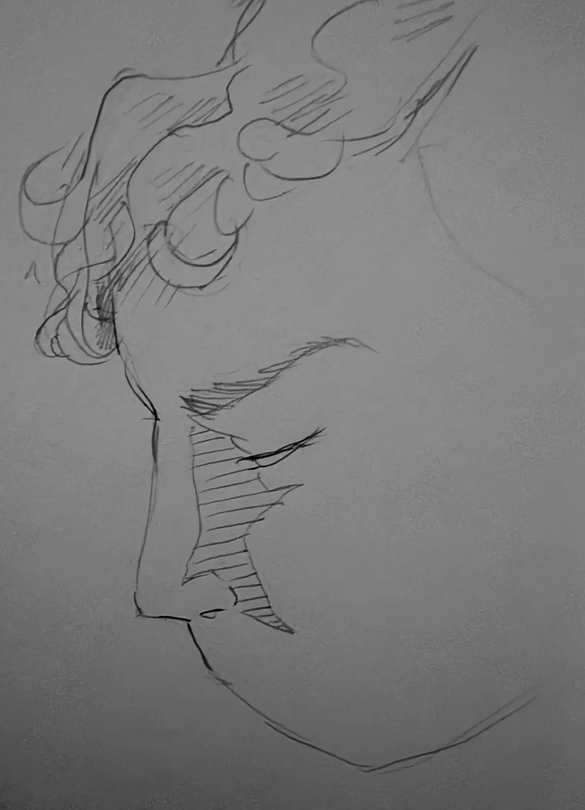 A rough pencil sketch of a stylized human face in profile, showing an eye, nose, and hair, with the text 'i drew this and…