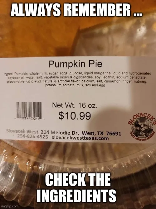 A close-up of a store-bought pumpkin pie in plastic packaging, showing its ingredient label which lists items like pumpkin…