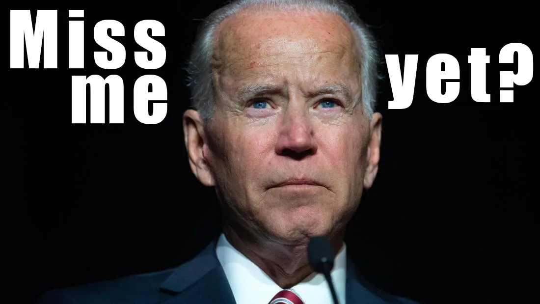 A close-up image of Joe Biden looking serious and slightly downward, wearing a dark suit, white shirt, and red tie, with a…