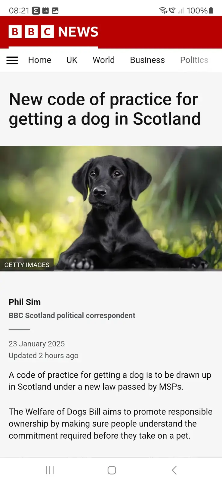 A screenshot of a BBC News article titled 'New code of practice for getting a dog in Scotland' features a photo of a black…