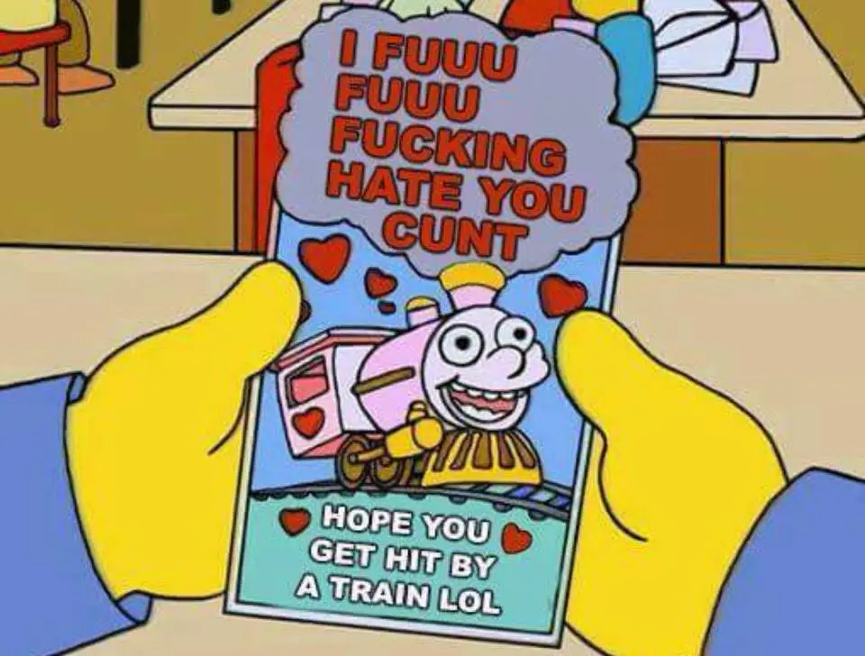 A cartoon character with yellow hands holds a Valentine's card featuring a smiling pink train. The card has red hearts and…
