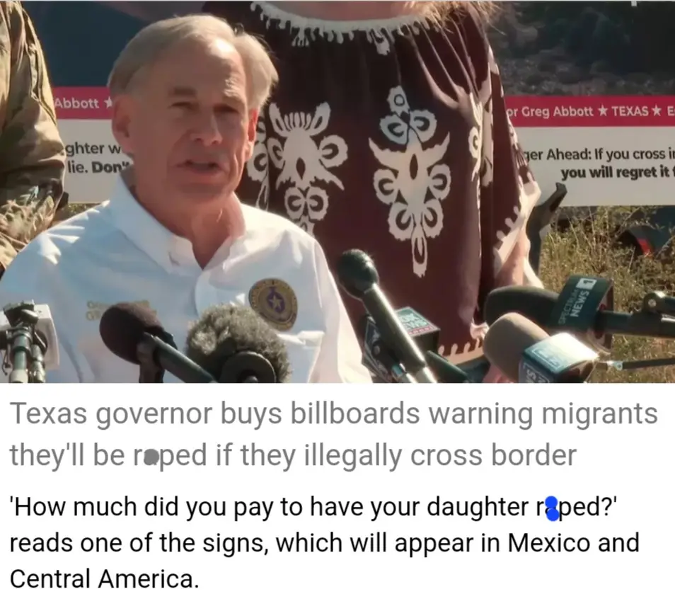 A man in a white shirt with a governor's seal speaks at a press conference surrounded by microphones, with a woman in a…
