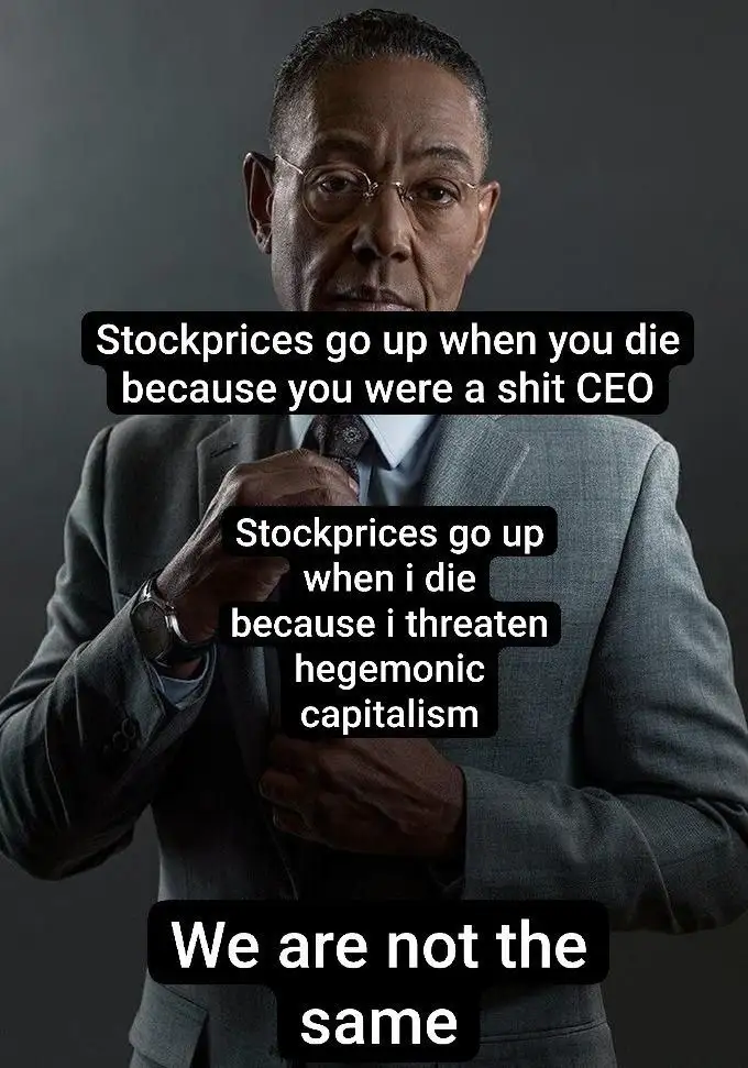 A man in a grey suit and glasses adjusts his tie against a dark background. Three black text boxes overlay the image: the…