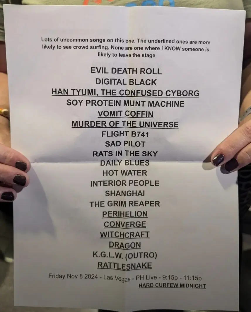 A person holds a printed setlist for a concert on Friday, November 8, 2024, in Las Vegas. The list includes songs like 'Evil…