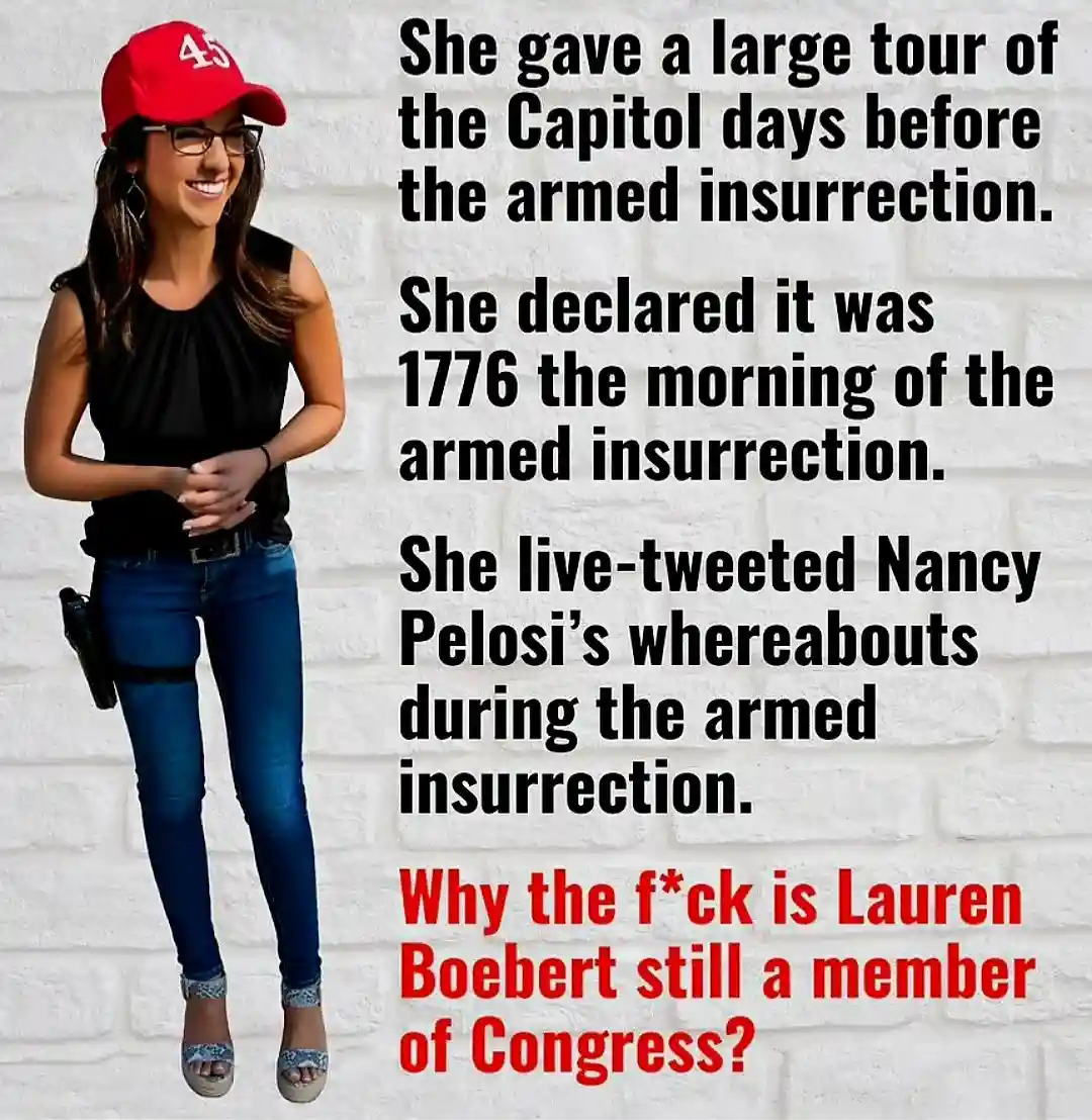 A woman wearing a red '45' cap, glasses, a black top, blue jeans, and a gun holster on her hip stands against a white brick…