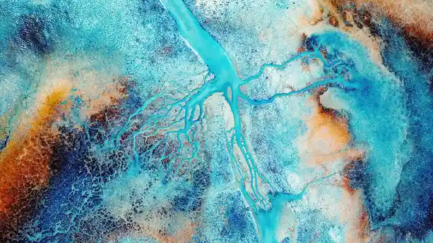 A vibrant Pollock-esque splash of azures and ochres emerges from the shallow waters of Lake YarÃÂ±Ã ÂlÃÂ± in southwestern…