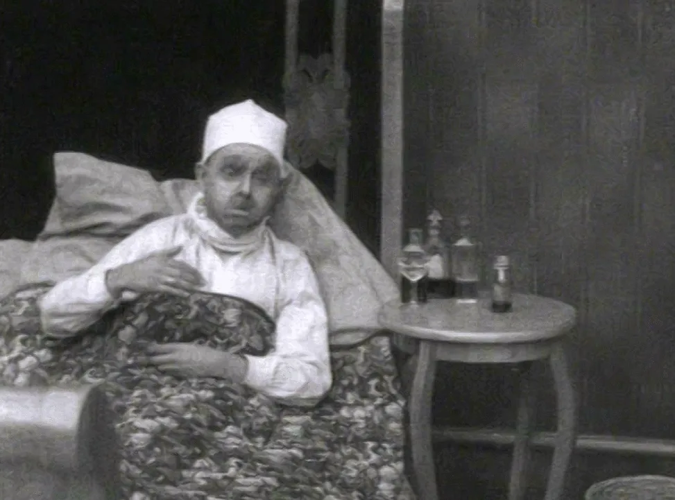 A black-and-white photo sequence shows a man in a white cap and robe sitting in bed, reaching for bottles on a side table…