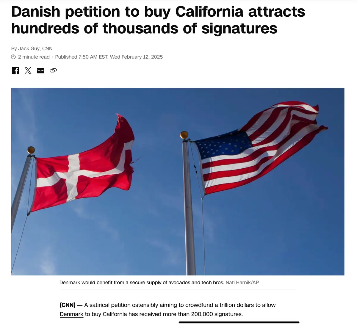 The image shows two flags waving against a blue sky: the red Danish flag with a white cross on the left and the American…