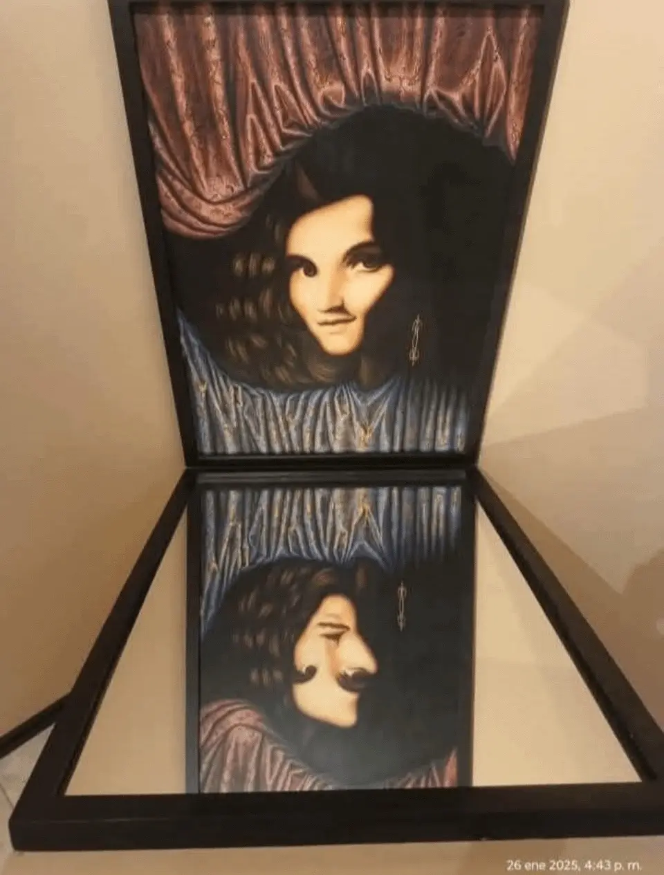 A framed painting is open like a book, revealing a portrait of a woman with dark hair and a blue ruffled collar on the top…