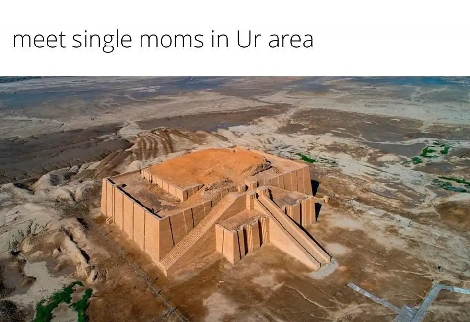 An aerial photograph shows the ancient ziggurat of Ur, a massive stepped pyramid made of sun-baked brick, situated in a…