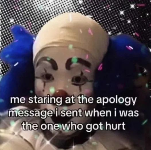 A close-up image of a creepy clown with a white face, red nose, and blue hair, set against a black background with sparkling…