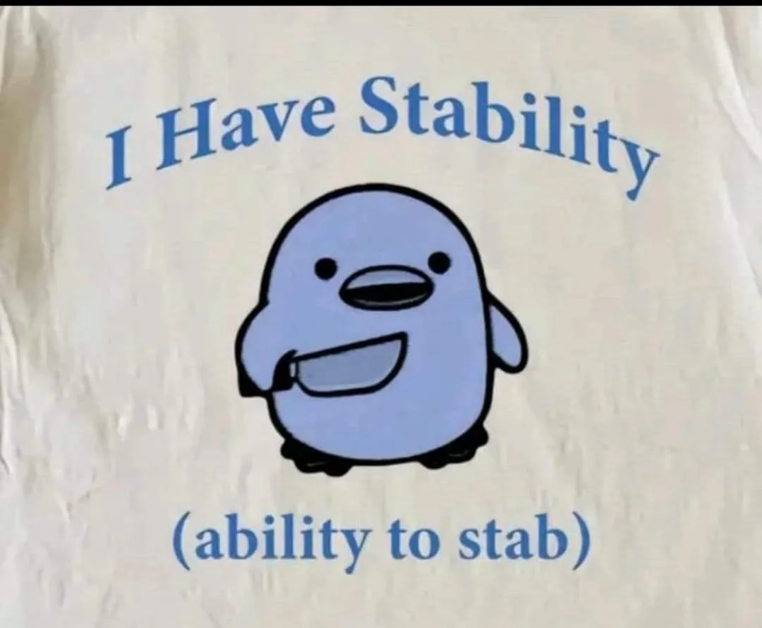 A close-up of a light-colored t-shirt with blue text and a cartoon penguin. The text above the penguin reads 'I Have…