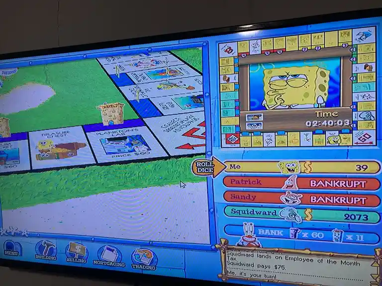 A screenshot of a SpongeBob SquarePants themed Monopoly game on a TV screen, showing the game board with properties like…