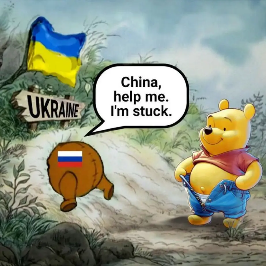 A cartoon Winnie the Pooh stands on a dirt path, looking back at a brown bear-shaped object with a Russian flag on its rear…