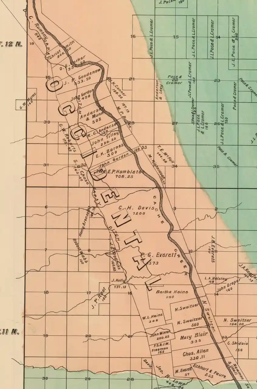 An old land survey map shows property parcels with names and acreage, overlaid with the large, bold, blocky letters 'O C H E…