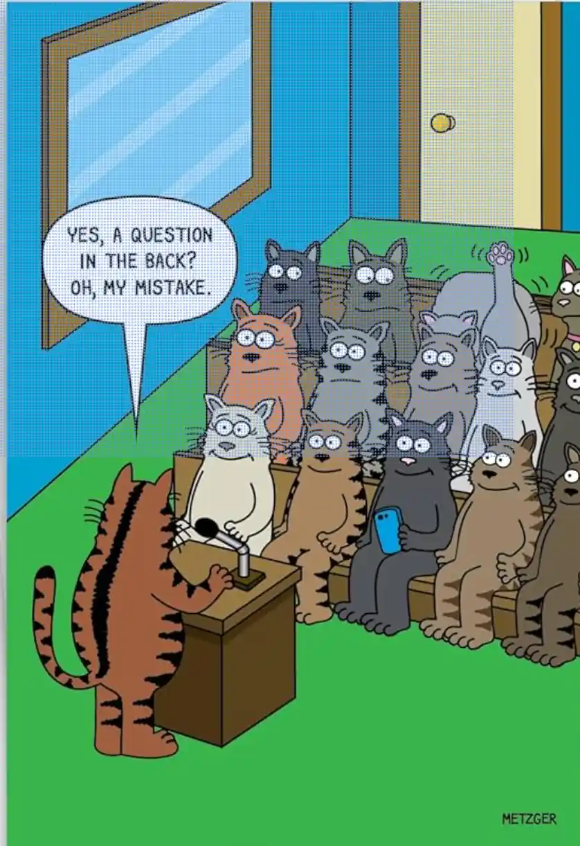 A cartoon tiger stands at a podium addressing a large audience of cats seated in rows. One cat in the back raises its paw to…
