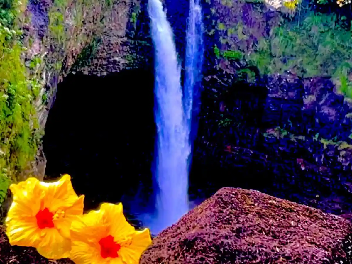 A heavily saturated and stylized photo of a waterfall cascading into a dark pool, framed by mossy rocks. In the foreground…