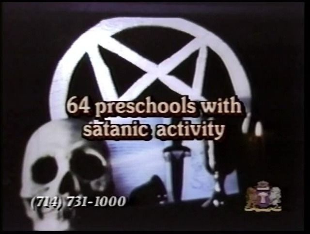 A grainy, low-resolution image features a white pentagram inside a circle, a skull in the foreground, and a candlestick in…