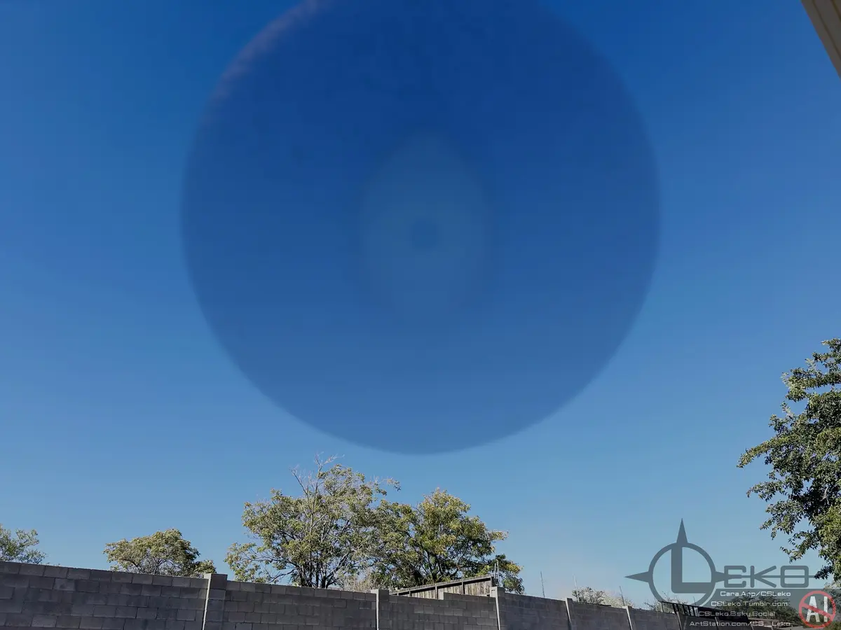 A bright blue circular lens flare dominates the sky above a gray brick wall and green trees, with overlaid text reading…