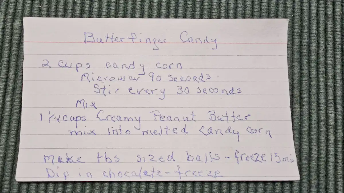 A handwritten recipe on lined paper titled 'Butter Finger Candy' instructs to melt candy corn, mix in creamy peanut butter…