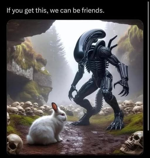 A white rabbit sits calmly on a dirt path surrounded by skulls, facing a towering, menacing alien creature from the movie…