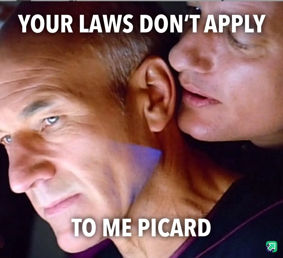 A close-up image shows one man whispering into the ear of another man. The whisperer is partially visible, while the…