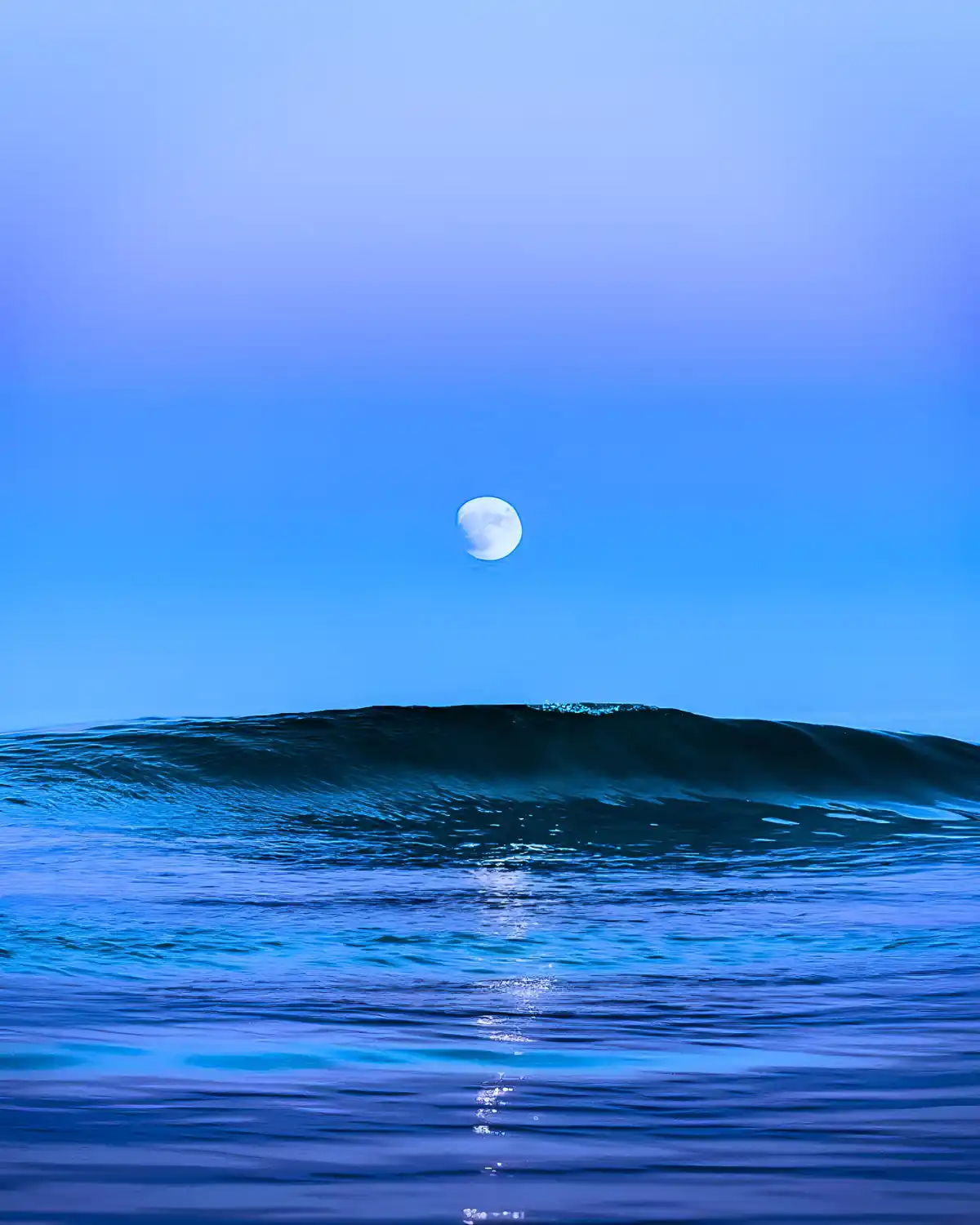 Breathtaking moonrise over the tranquil sea