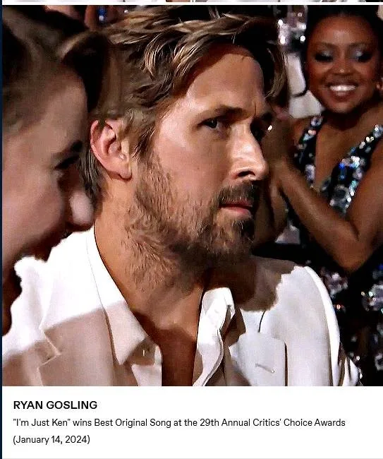 A close-up photo of actor Ryan Gosling looking serious and slightly bewildered while seated at an awards ceremony. He is…