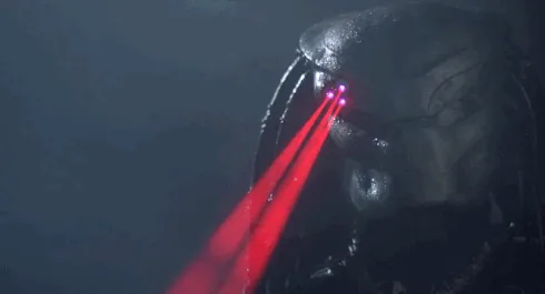 The image shows a close-up of the Predator's head with glowing red laser eyes, repeated in six panels. The overlaid text…