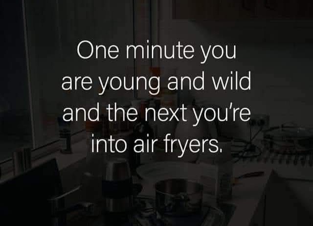 A dimly lit kitchen counter with various appliances and clutter, overlaid with white text reading 'One minute you are young…