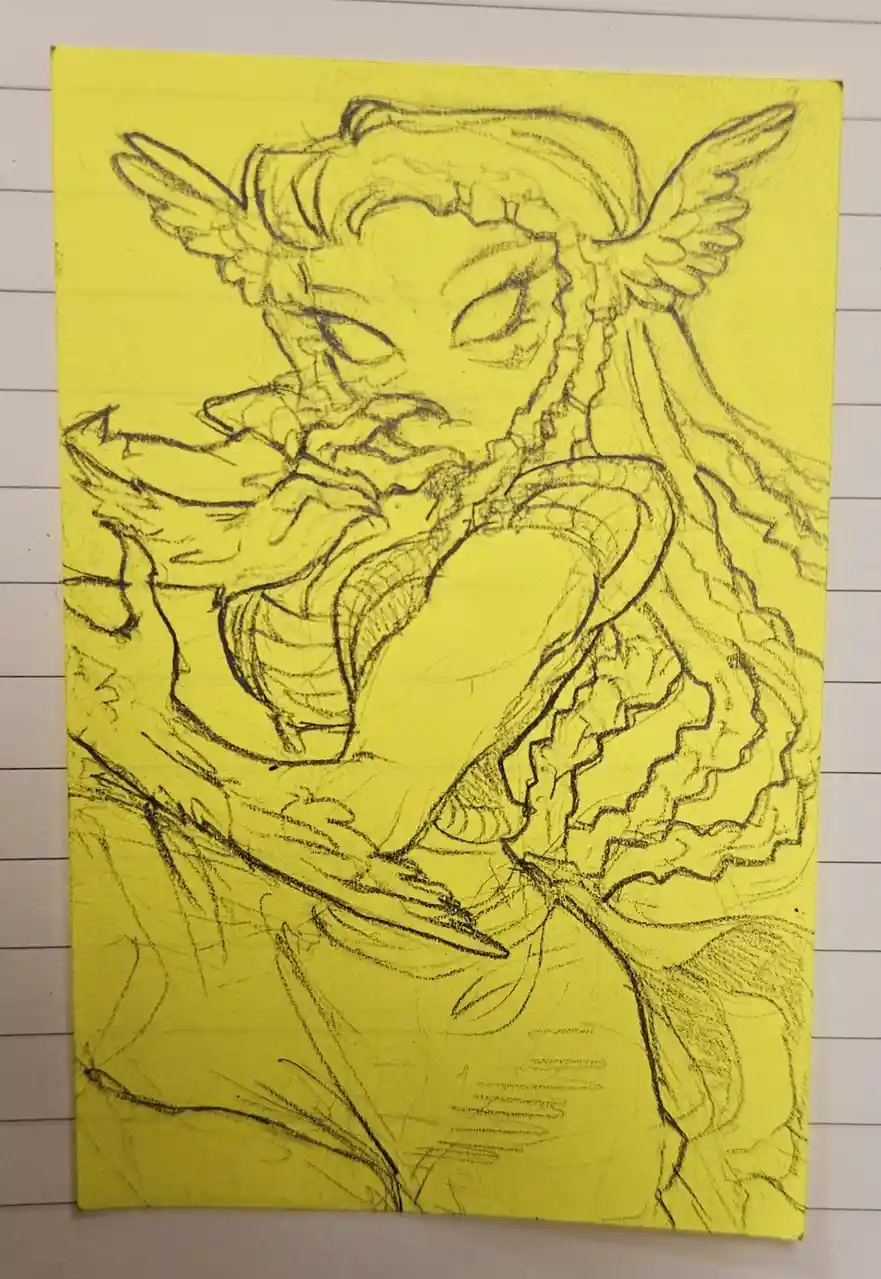 A rough pencil sketch on yellow paper depicts a fantastical creature with wings, long hair, and a large, open mouth showing…