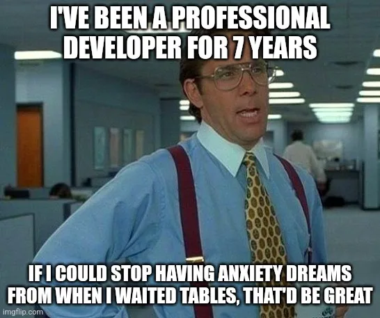 A man in a blue shirt, red suspenders, and patterned tie stands in an office with a surprised expression. The overlaid text…