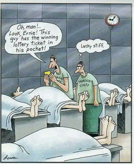 In a morgue, two staff members in green 'MORGUE STAFF' shirts stand beside rows of covered bodies on metal tables. One man…