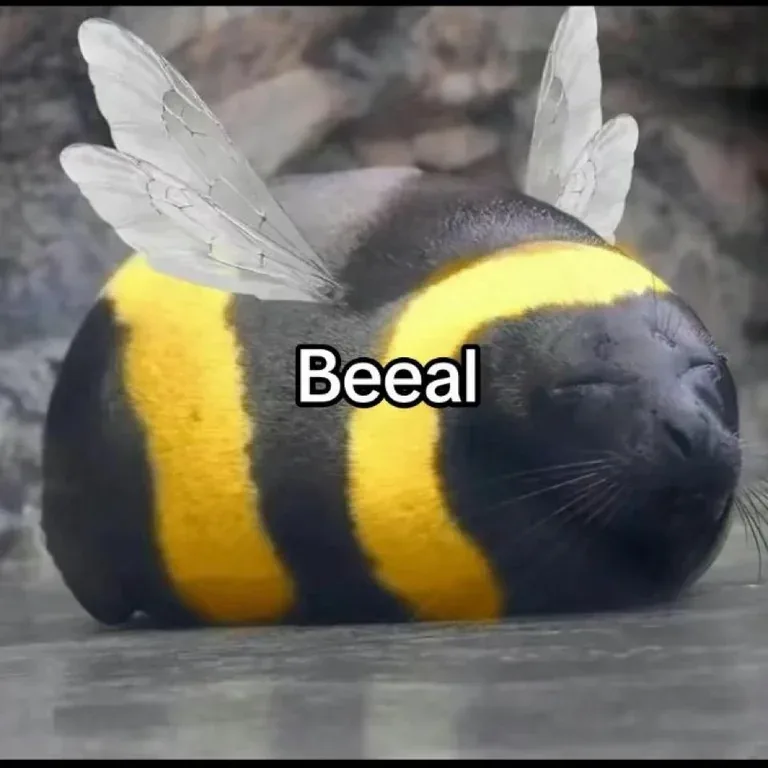 A seal is digitally edited to have a bee's yellow and black striped body and translucent wings, lying on its side with eyes…